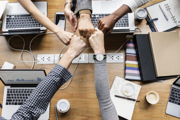 Colleagues giving a fist bump